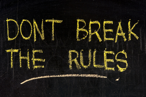 On a black background, the words "Don't Break the Rules" appear as if written on a chalkboard.