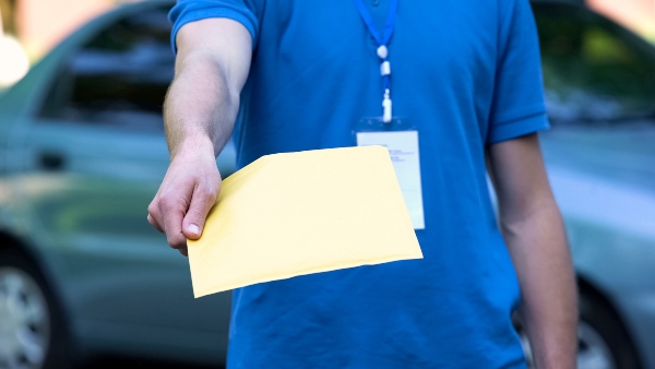 A process server hands off papers to the viewer in this picture.